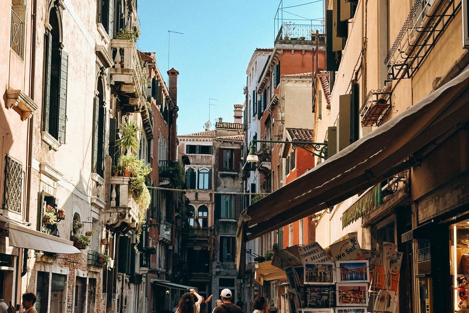 A family walking down a historic European street.